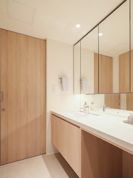 使うたびに心に気品とゆとりを与えてくれるホテルライクな洗面化粧台は、キッチンと同じくオリジナルで造作した設備です。広々としたカウンタースペースの下にはチェアなどを配置することもできます。